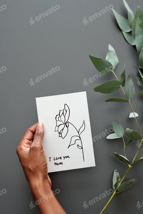 Preview: Hand of woman holding greeting postcard