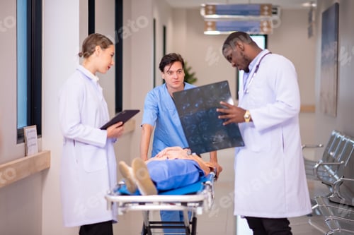 Preview: medics and patient on hospital gurney at emergency