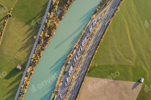 Preview: Top down aerial view of highway interstate road with fast moving traffic and parking lot