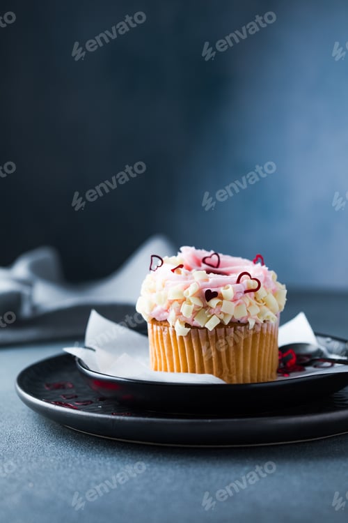 Preview: Delicious Cupcake with Pink Frosting and Red Hearts
