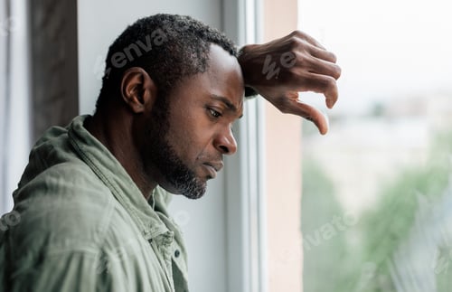 Preview: Unhappy frustrated adult african american guy in casual suffering from depression and bad news near