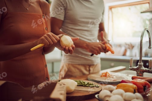 Preview: Healthy, diet and food of a couple preparing or making a meal together for lunch in the kitchen at