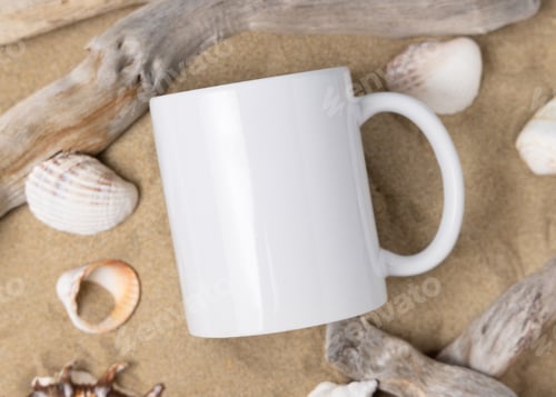 Preview: Coffee mug mockup, white blank ceramic mug on sand with seashells and driftwood, copy space