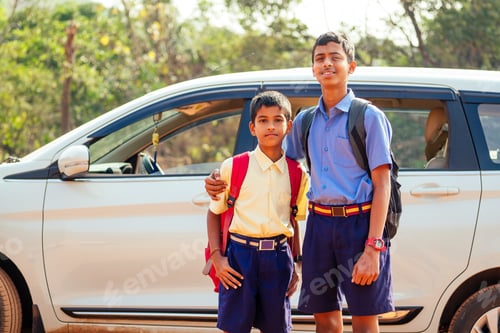 Preview: two indian boys ready to go to school on the car