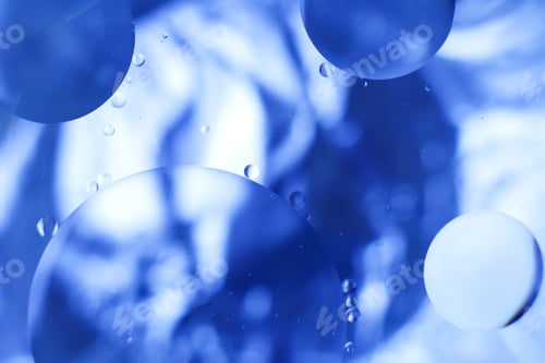 Preview: Oil bubbles close up. circles of water macro. abstract light blue background