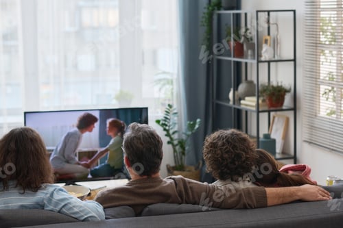 Preview: Family watching movie together at home