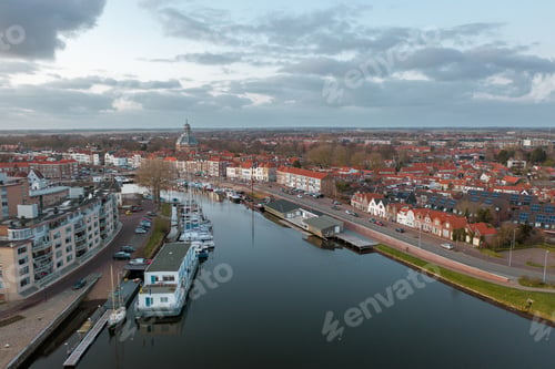 Preview: Mesmerizing view of the river in Middelburg city in the Netherlands surrounded by buildings