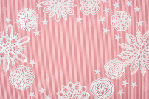 Preview: christmas frame with paper snowflakes and stars on pink background