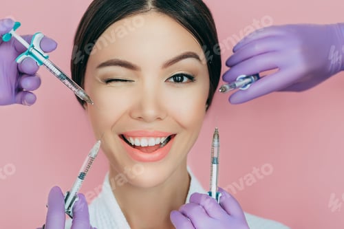 Preview: Portrait of a beautiful winking woman and many syringes with beauty injections around her face