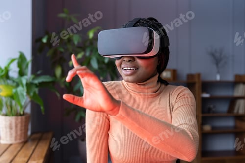Preview: Afro woman enjoy vr gaming using virtual reality interface for shopping or game wear goggles at home