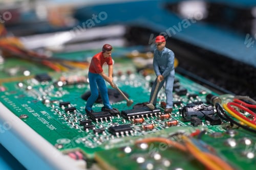 Preview: toy workers working on electronic chip