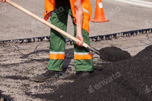 Preview: Workers on Asphalting paver machine during Road street repairing works.