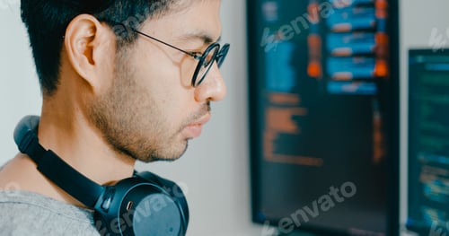 Preview: Closeup young adult Asia male freelance eyeglasses typing write prompt AI bot IT app program nomad.