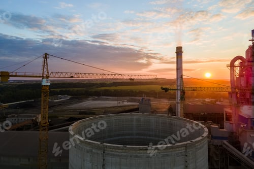 Preview: Aerial view of cement factory under construction with high concrete plant structure