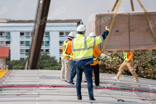 Preview: Service engineer installing solar cell on the roof of factory. Clean and Renewable energy concept.