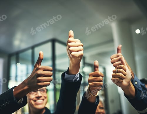 Preview: Closeup shot of a group of unrecognizable businesspeople showing thumbs up in an office