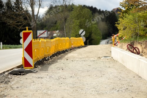 Preview: Yellow Plastic Temporary Barrier Fence on the Road during Sidewalk Repair