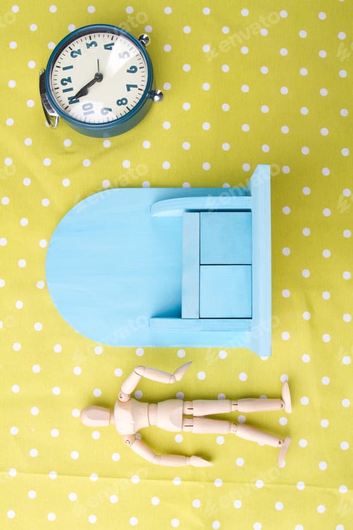 Preview: Small toy furniture. Wooden human mannequin figure with classic alarm clock.