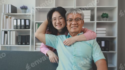 Preview: A father and daughter sat in the living room happily spending time together after not seeing each ot