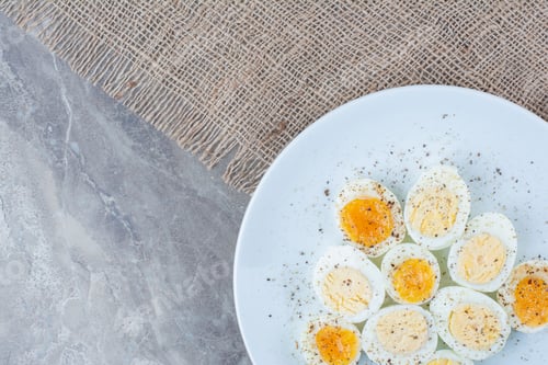 Preview: Boiled tasty eggs with spices on white plate