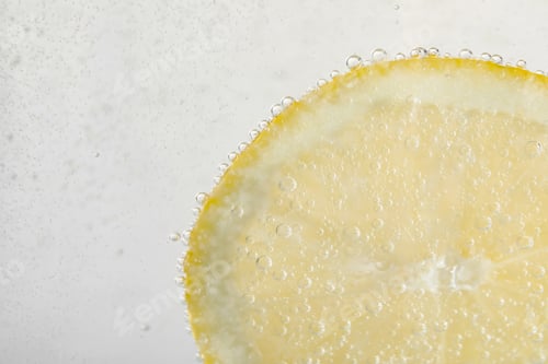 Preview: Soda water with lemon slice as background, closeup