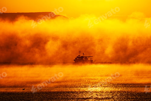 Preview: Fishing boat coming through the fog with Seaford Head in the background.