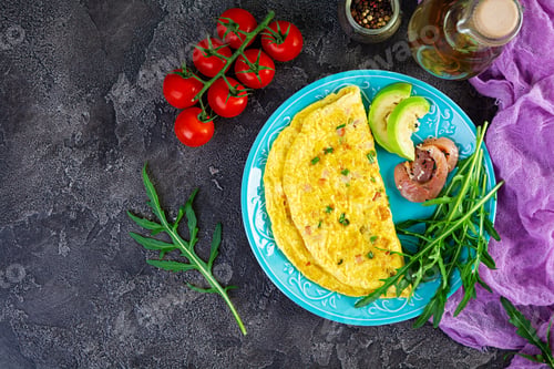 Preview: Fried omelette with ham, onion and herbs. Breakfast with scrambled eggs