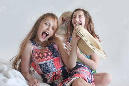 Preview: Playful Preteen Girls in Sundresses and Straw Hats