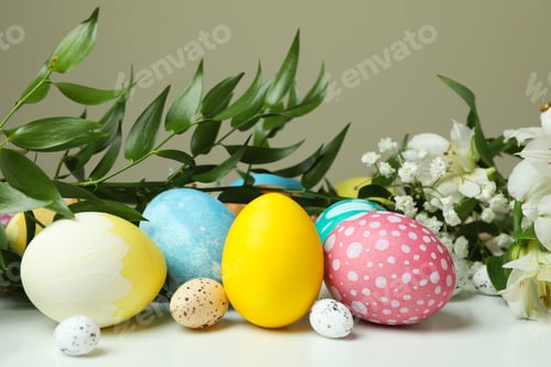 Preview: Easter eggs and beautiful flowers on white table