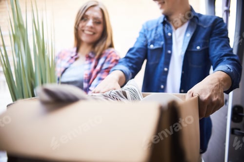 Preview: Happy Couple Unloading Moving Van