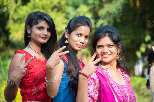 Preview: Happy Indian young girls smiling and having fun at outdoor.