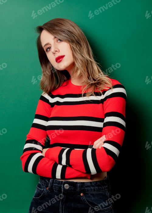 Preview: Woman in striped sweater on green background