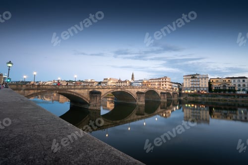 Preview: Sunset sene of St. Angelo Bridge over River Tiber in Rome, italy under gray dramatic sky