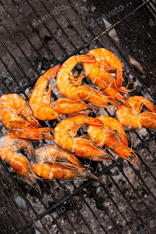 Preview: Cooking grilled prawns on barbecue. BBQ shrimps, close up.