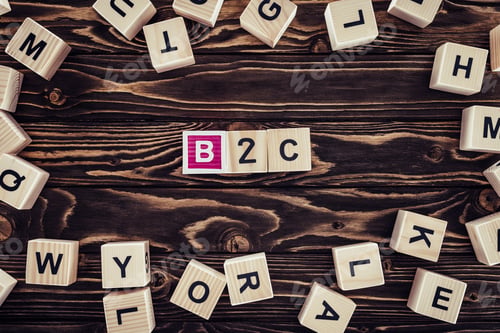 Preview: flat lay with b2c inscription made of wooden blocks on brown wooden tabletop
