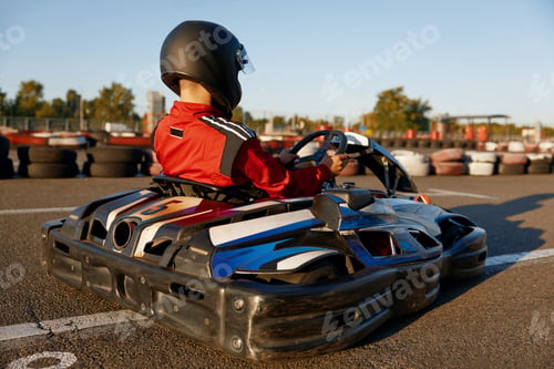 Preview: Diver racing on go-cart track outdoors enjoying competitive activity