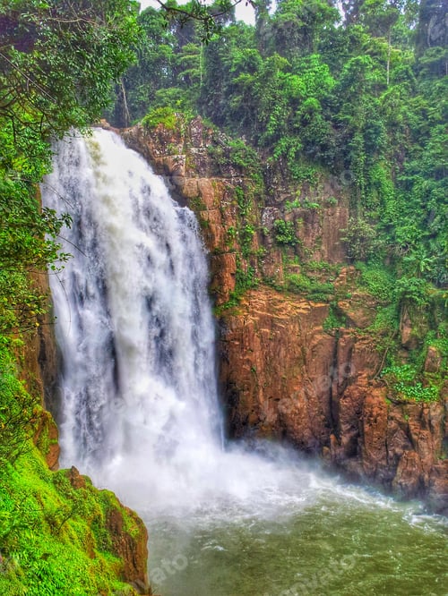 Preview: Beautiful huge waterfall in green nature background