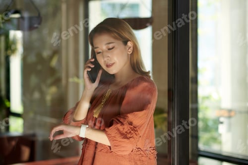 Preview: Woman Checking Notifications on Smartwatch