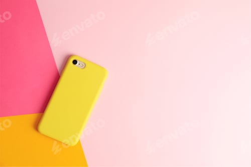Preview: Modern phone on color background, top view. Space for text
