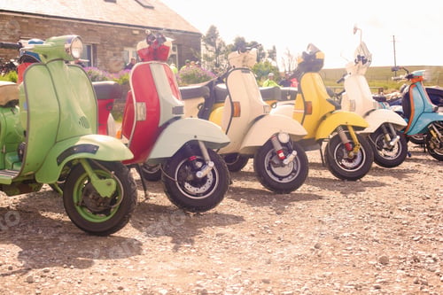 Preview: Colourful scooters parked in a row