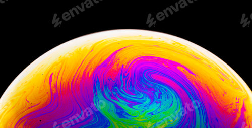 Preview: Rainbow soap bubble on a dark background. Close-up of colorful surface.