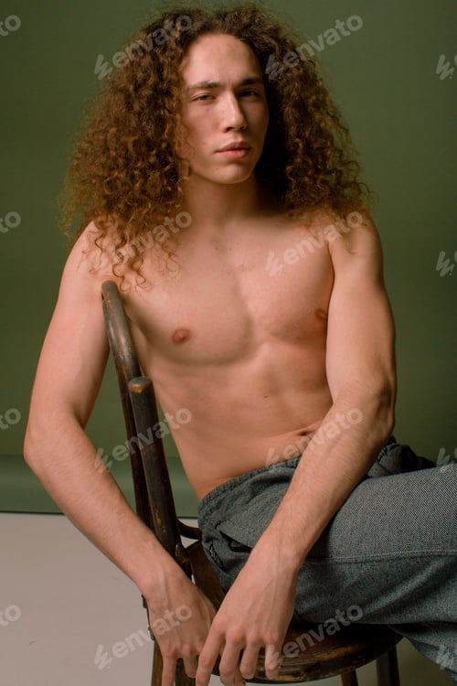 Preview: Attractive And Stylish Guy With Curly Hair And A Sports Figure