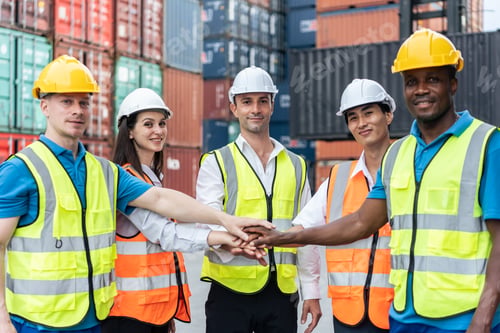 Preview: Group of man and woman worker put hand on each other in container port.