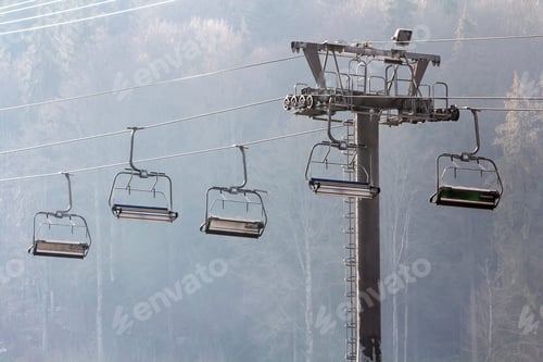 Preview: Ski lift with empty seats in ski resort