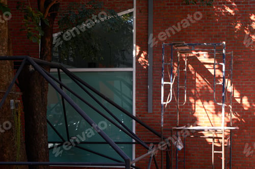 Preview: The scaffolding and brick wall of building