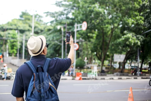 Preview: Tourist Asian Male Doing Vlog Using Smartphone
