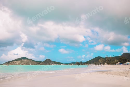 Preview: Idyllic tropical beach with white sand, turquoise ocean water and blue sky