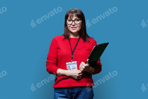 Preview: Middle-aged woman with clipboard and business center badge, on blue background