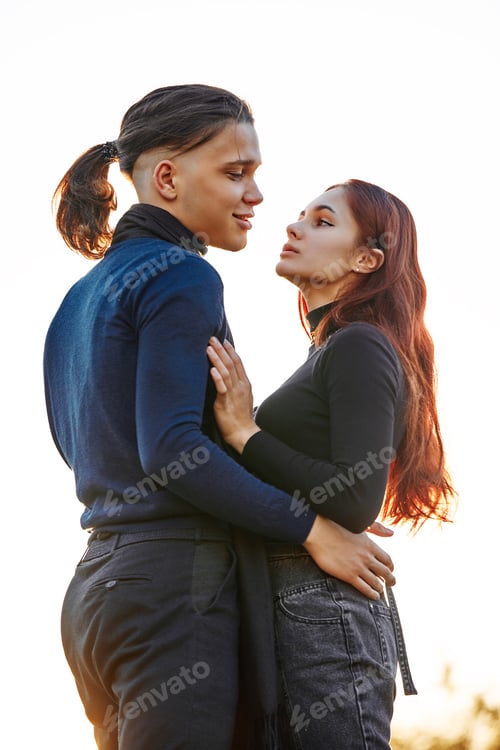 Preview: happy young couple kissing outdoor in the autumn park