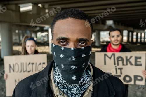 Preview: Black protester in bandana on face